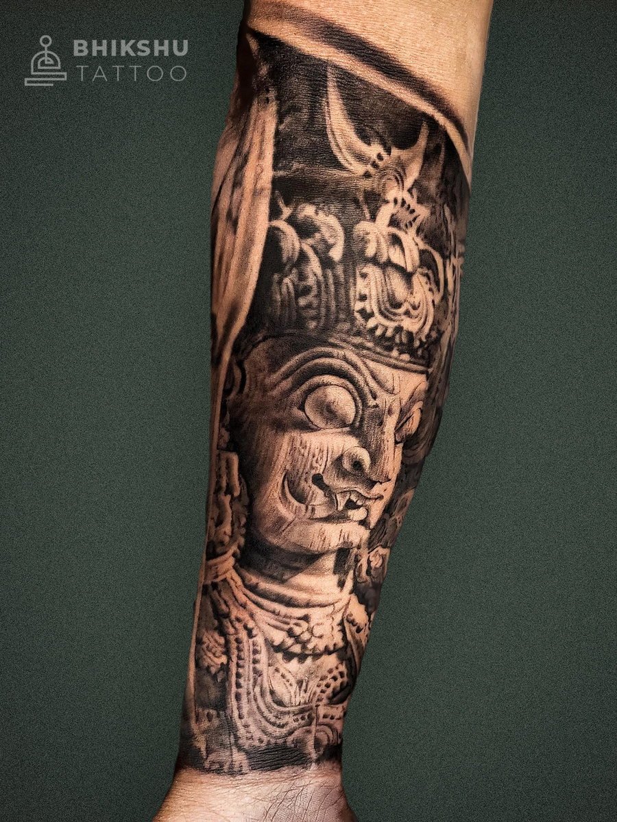 Black and grey sculpture sleeve tattoo by Bhikshu Tattoo Studio, Pune