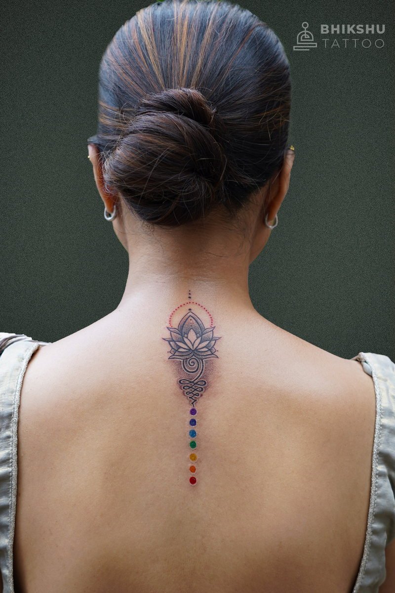 Fine line lotus mandala spine tattoo by Bhikshu Tattoo Studio